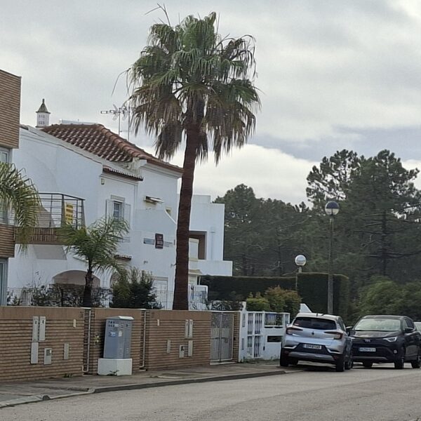 The street with the house where we live and my car